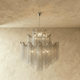 A four tier silver version, each band waved and fringed with fine chain