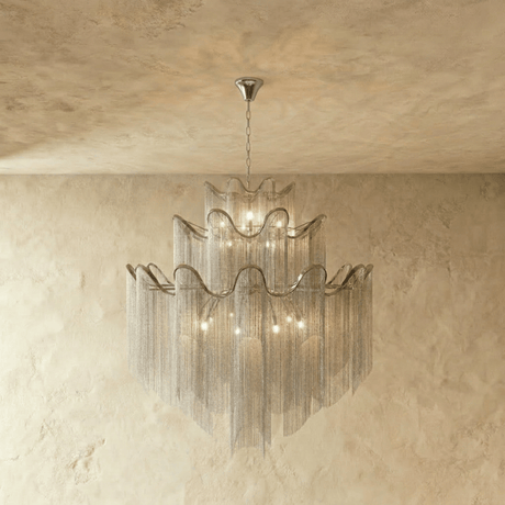 A four tier silver version, each band waved and fringed with fine chain