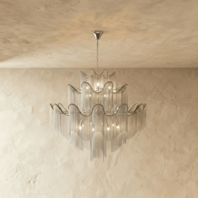 The same tiered form in silver, wavy bands above curtains of fine hanging chain