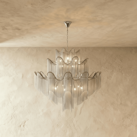 The same tiered form in silver, wavy bands above curtains of fine hanging chain