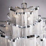 The silver bands seen from underneath, chain falling from every tier