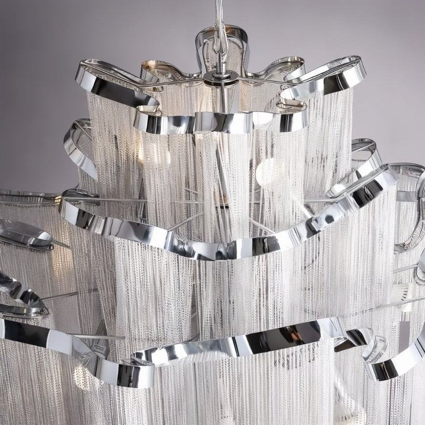 The silver bands seen from underneath, chain falling from every tier