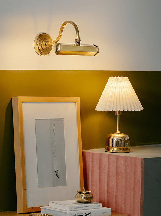 Traditional wall sconce with a metallic finish