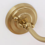 Close view of the round stepped plate where the curved arm meets the wall