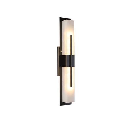 The pale panel and the black cross bar of the sconce seen at an angle