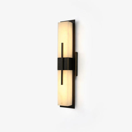 The veining in the panel picked out by the light along the sconce
