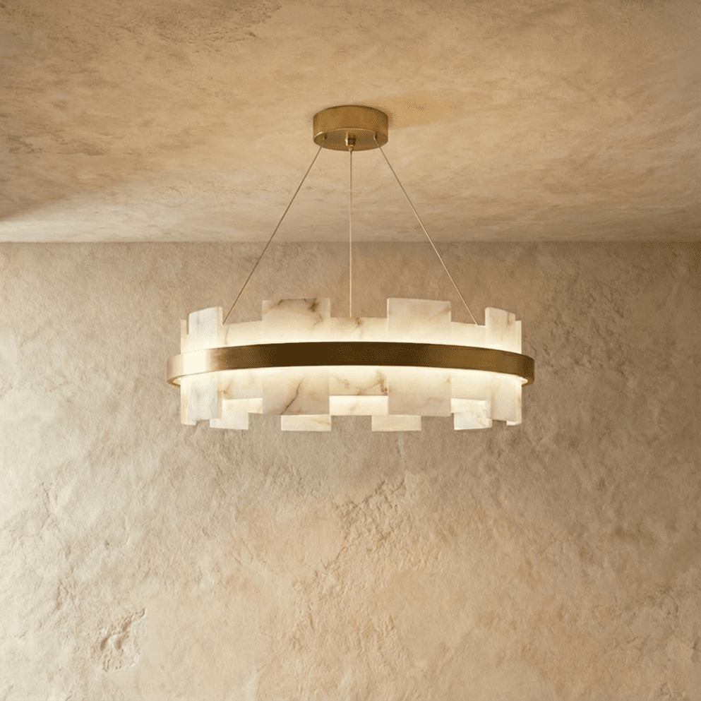 Stepped blocks of veined stone set around a lit brass ring