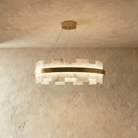 Stepped blocks of veined stone set around a lit brass ring