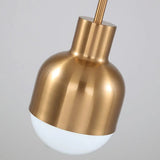 Close view of the brushed brass body above the white glass tip