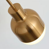 Close view of the rounded white glass tip under the brass body