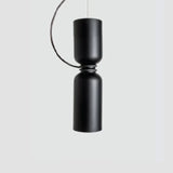 Slim black pendant made of two stacked cylinders