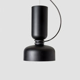 Tall black pendant with a long cylinder above a bowl