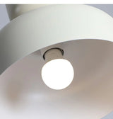 Underside of a cream shade showing the round bulb