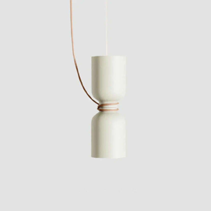 Cream pendant with a cylinder above a bowl, seen against gray