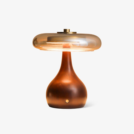 Small table lamp with an amber glass disc on a walnut gourd base, plain ground