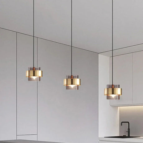 Three banded pendants seen from below against a white ceiling