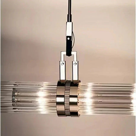 Close view of the chrome collar gathering the glass tubes together