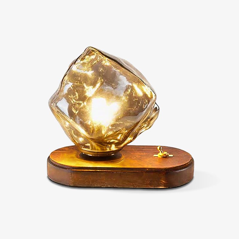 Amber glass ice form lit against a plain pale ground