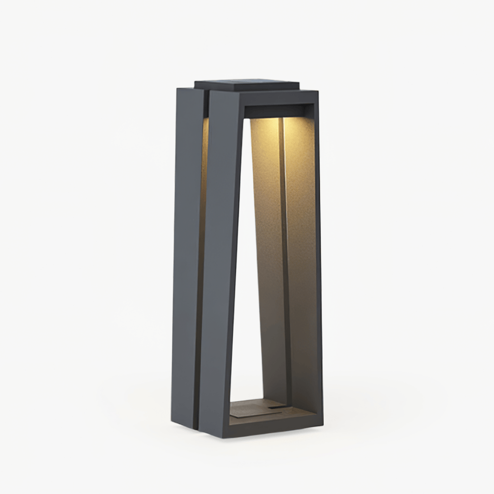 Trapezoid frame bollard light in dark gray with a lit inner panel