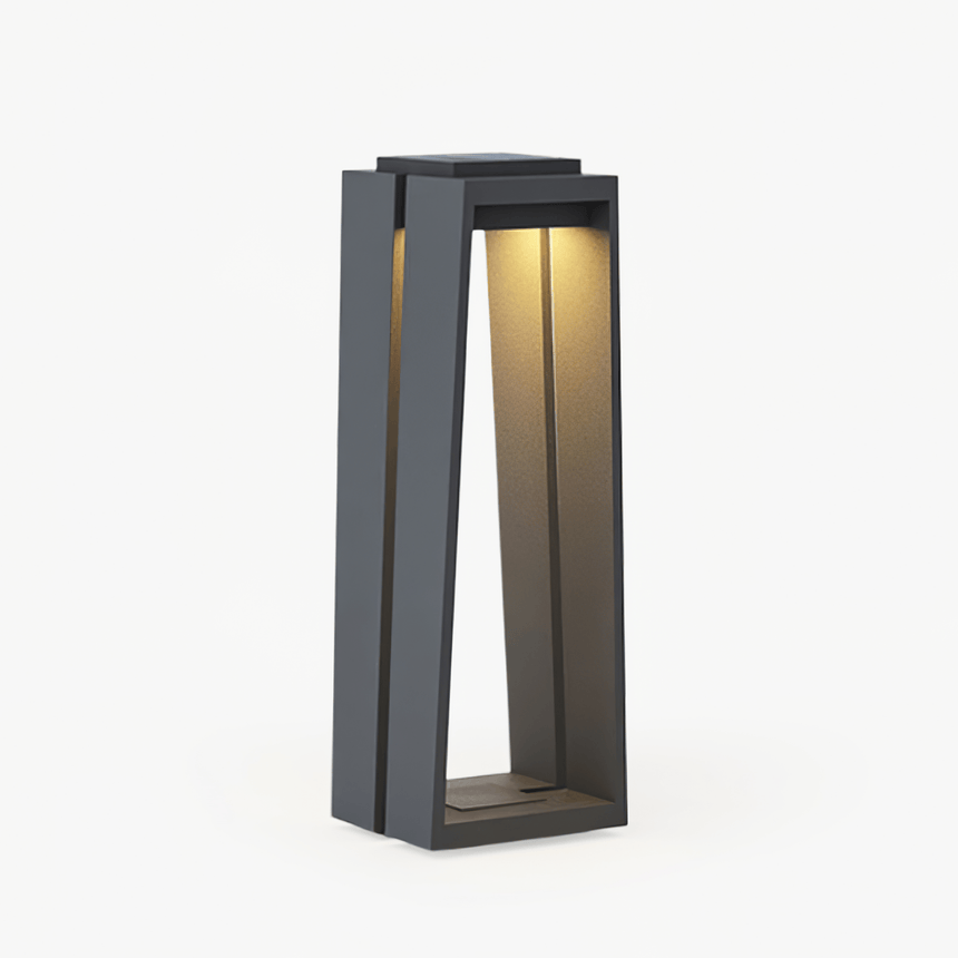 Trapezoid frame bollard light in dark gray with a lit inner panel