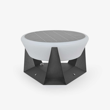 Round white dome light resting in a faceted dark base with sharp points