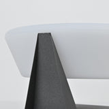 One of the folded points of the base rising against the lit dome