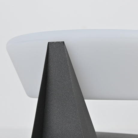 One of the folded points of the base rising against the lit dome