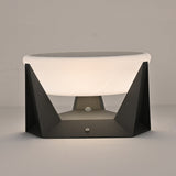 The round solar panel set into the flat top of the white dome shade