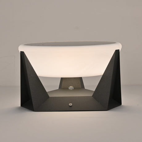 The round solar panel set into the flat top of the white dome shade