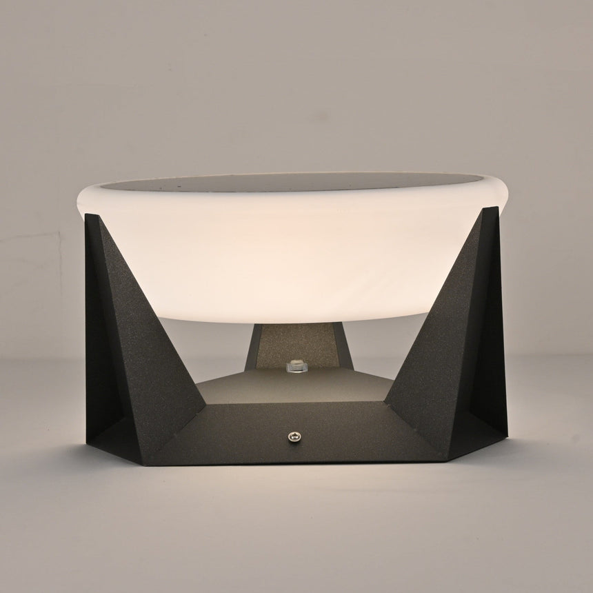 The round solar panel set into the flat top of the white dome shade