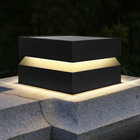 The cap lit on a granite pillar with the lit gap running around it