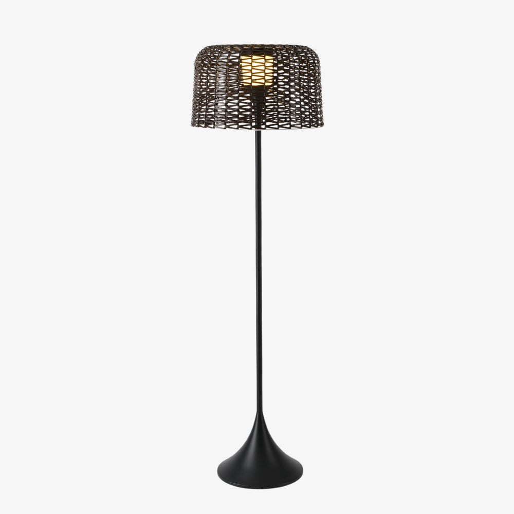 Tall slim floor lamp with a woven drum shade on a trumpet base