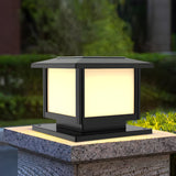 Warm glow from the cap on a pillar surrounded by garden foliage