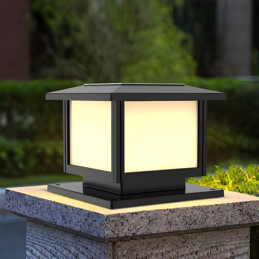 Warm glow from the cap on a pillar surrounded by garden foliage
