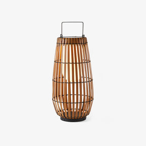 Rounded lantern in braided faux rattan with a slim metal carry handle