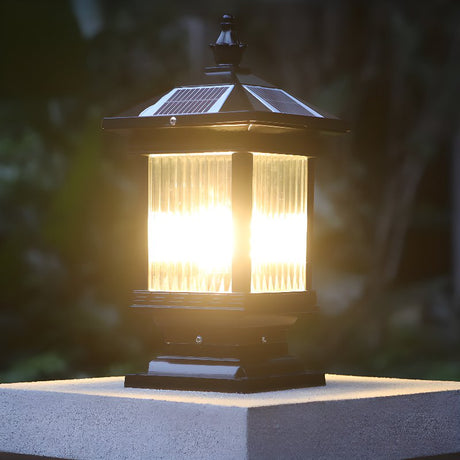 Warm light filling the ribbed glass on a pillar with a wall behind