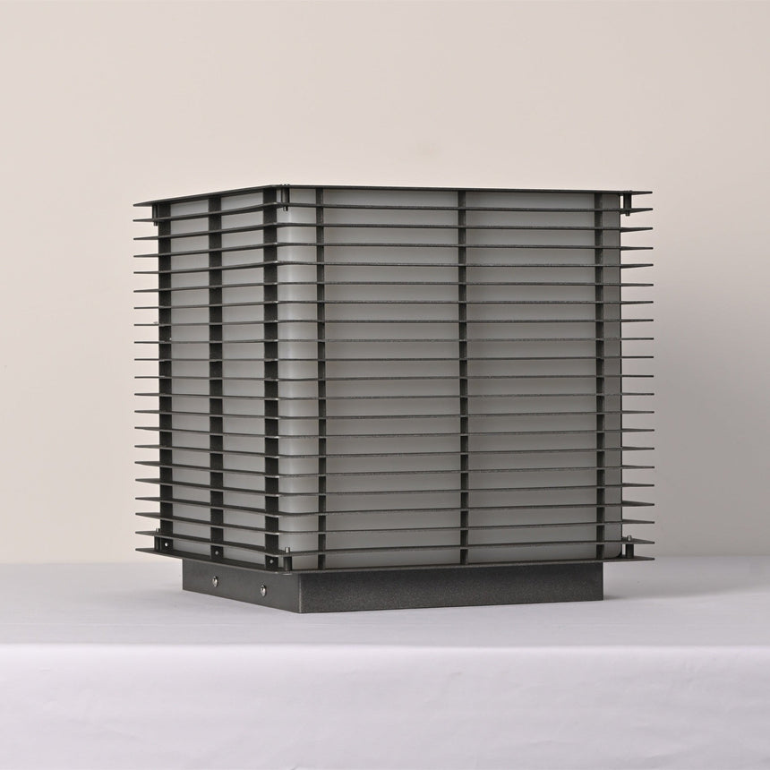 The stack of horizontal slats lit from within on a pale surface