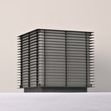 The stack of horizontal slats unlit showing the shadow gaps between