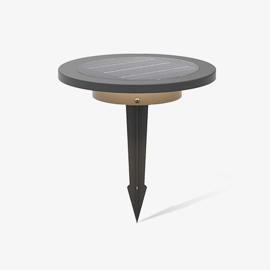 Round dark disc light on a long ground spike seen against pale gray