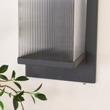 The open side of the frame with the ribbed tube and the fixing screws