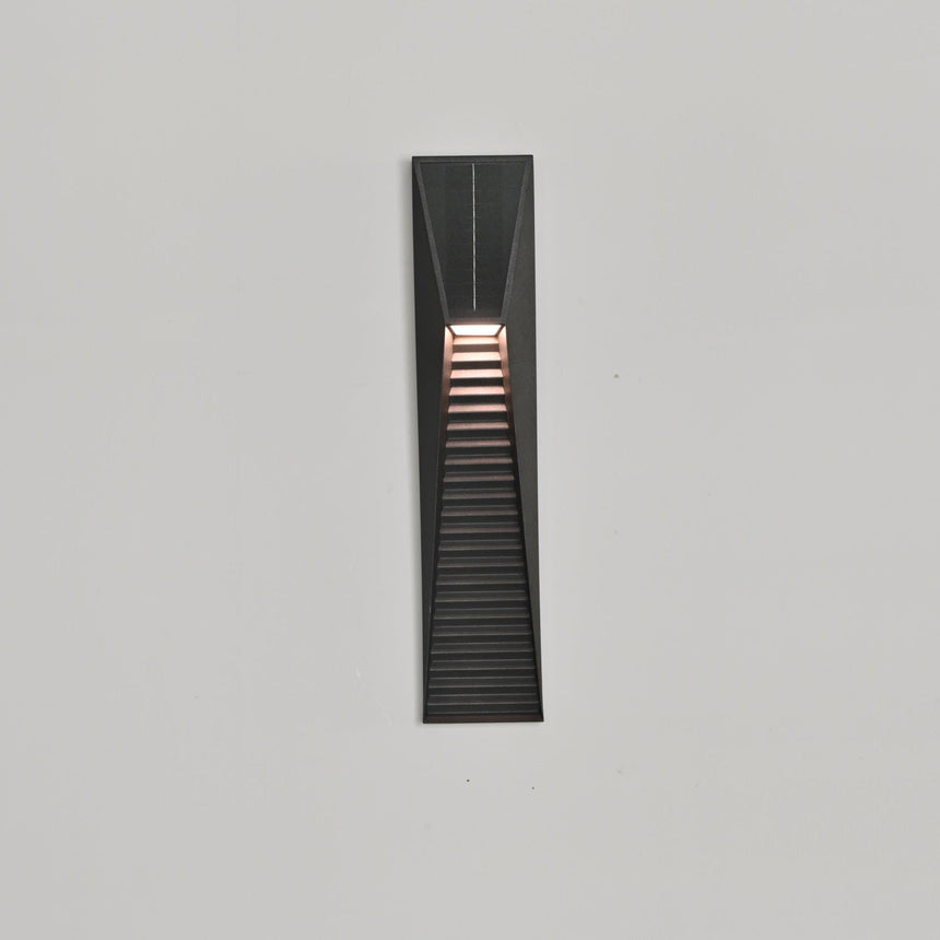 The light throwing bands of warm light down a pale render facade