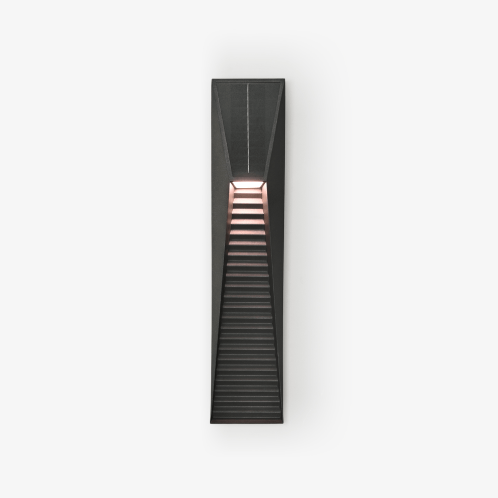 Slim black wedge step light with a louvered lower face on a pale wall