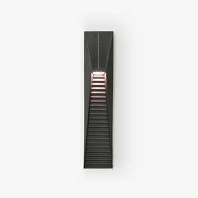 Slim black wedge step light with a louvered lower face on a pale wall