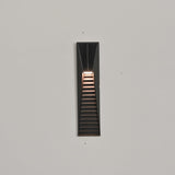 The shortest size lit low on a facade with the bands close together