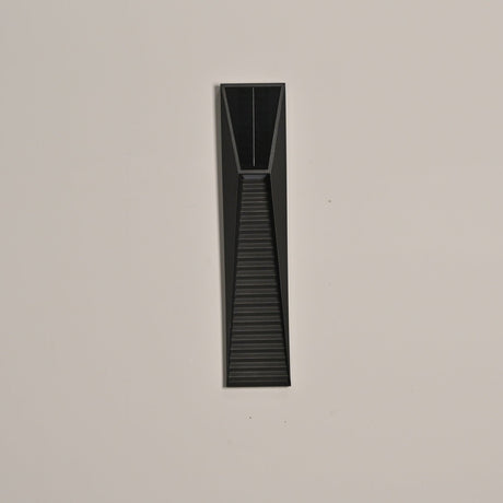 The step light unlit on a warm toned render facade seen straight along