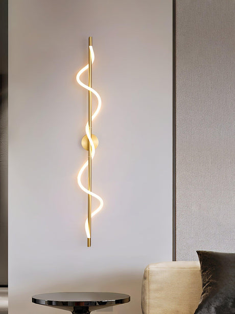 The lit spiral above a round table beside an armchair in a living room