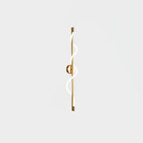 The brass version with its spiral band, seen on a pale background