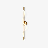 Slim gold rod wall sconce with a lit band spiralling around it