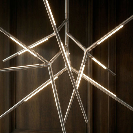 The chrome arms lit in front of dark wood, each rod glowing along its length