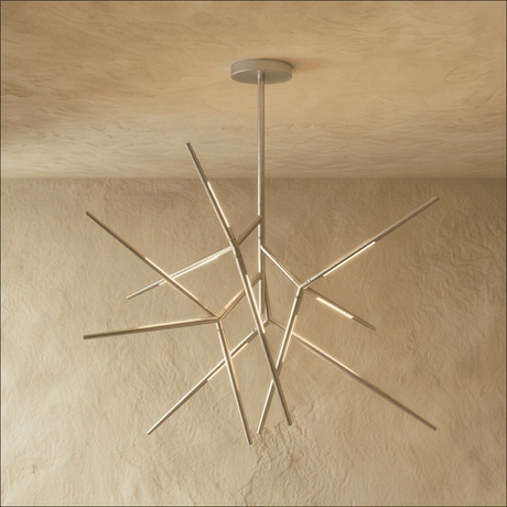 The same radiating form in chrome, each arm tipped with a lit segment